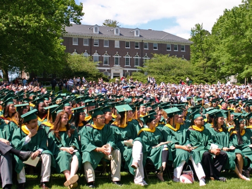 A graduating class sitting in front of Martin Hall.