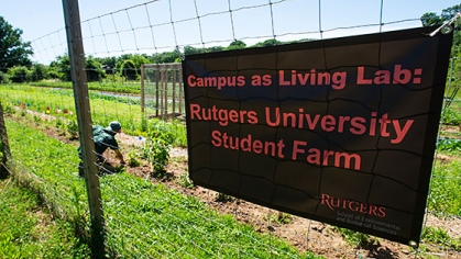 A sign that says, 'Campus as Living Lab: Rutgers University Student Farm'.